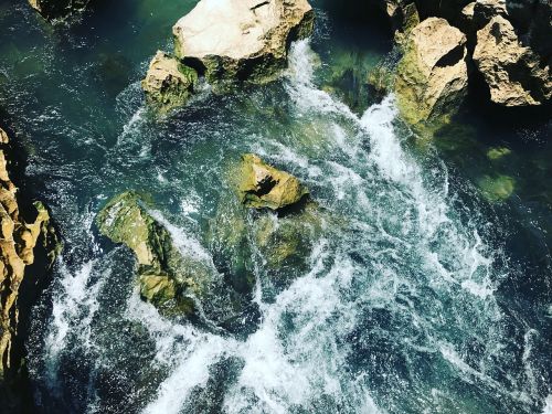 blue water blue waterfall rocky