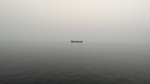 boat fisherman foggy