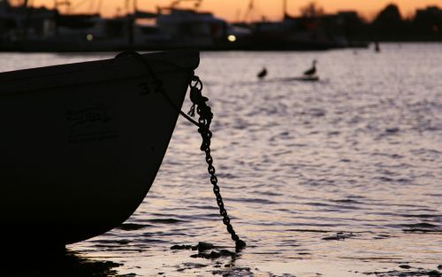 boats sunset water