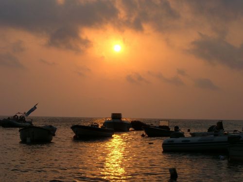 boats sunset sea