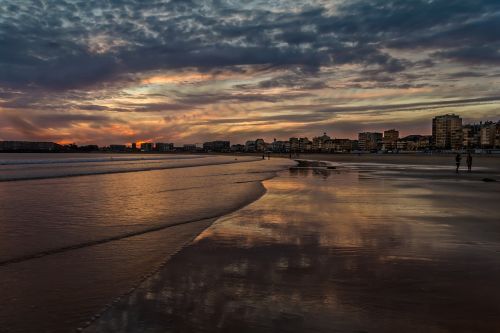 body of water sunset twilight