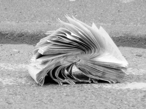 book abandoned crumpled