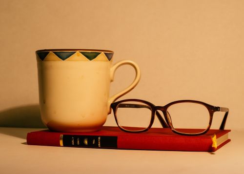 book eyeglasses mug