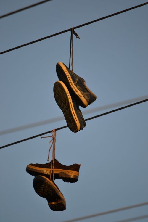boots hanging wire