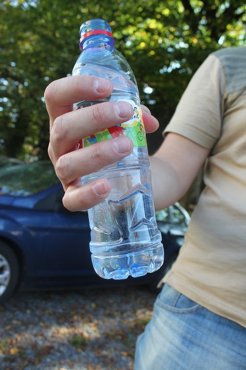 bottle  plastic bottle  bottle in hand