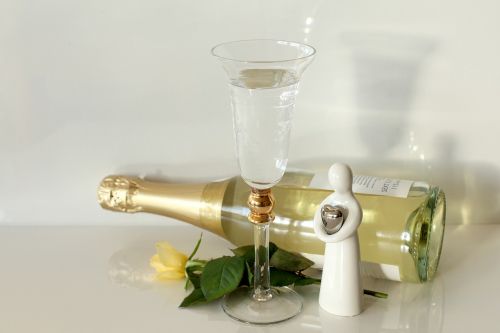 bottle of sparkling wine solemnly guardian angel