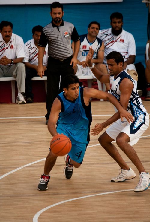 bouncing basketball action players