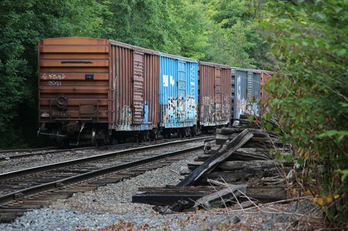boxcars  railroad tracks  graffiti