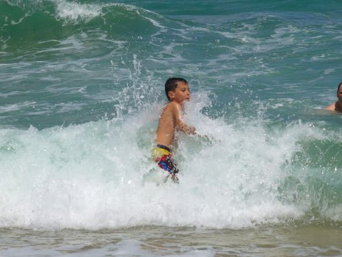 boy waves ocean