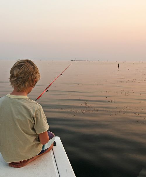 boy lake fishing