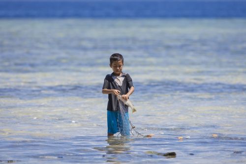 boy fishing halmahera