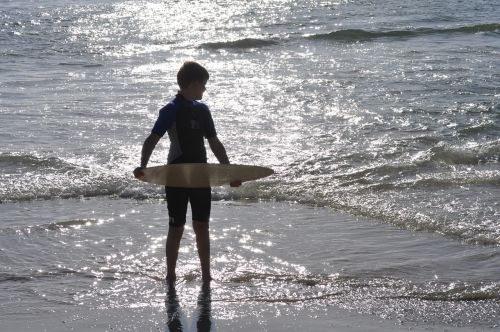 boy beach sunset