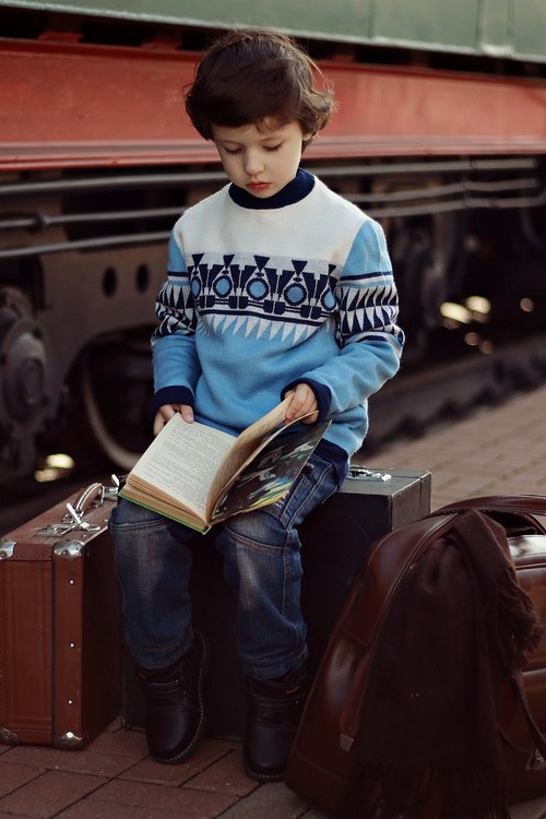 boy  suitcases  books