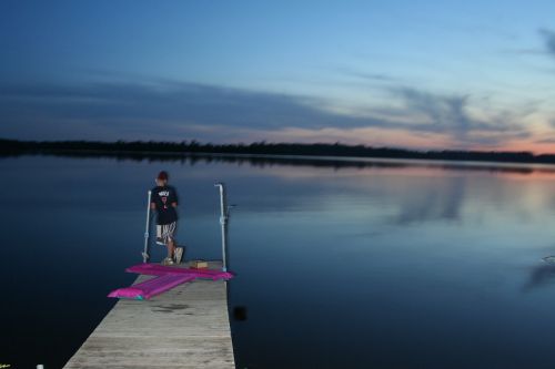 boy pier evening