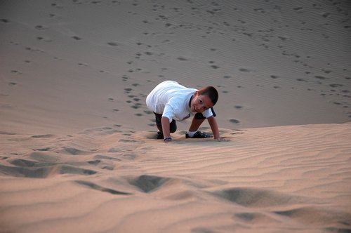 boy  dunes  sand