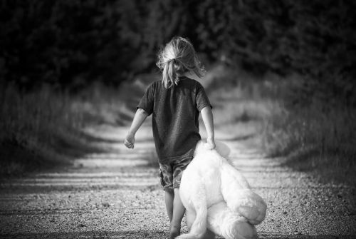 boy walking teddy bear
