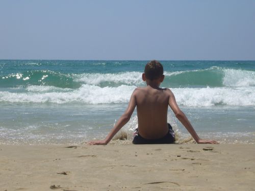 boy beach watch sit