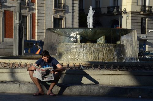boy reading newspaper newspaper reading