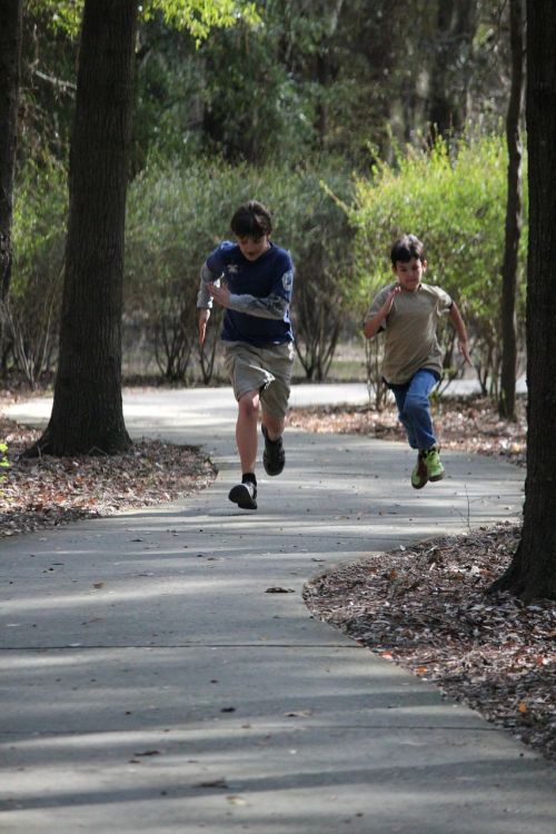 boys running trails summer