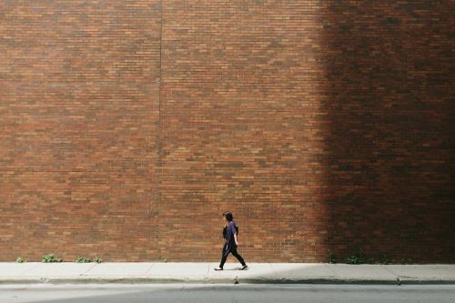 brick wall girl pavement