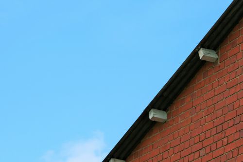 Brick Wall And Blue Sky