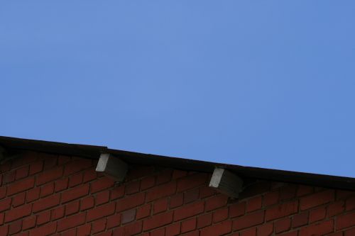 Brick Wall, Roof And Blue Sky