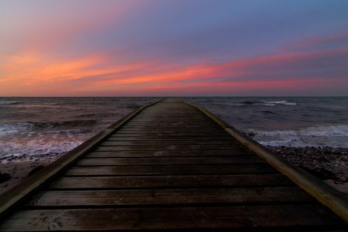 bridge sea sunrise