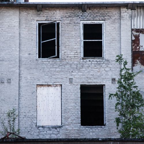 broken windows brick wall abandoned factory