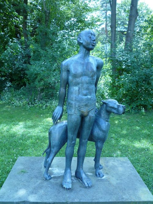 bronze figure man dog