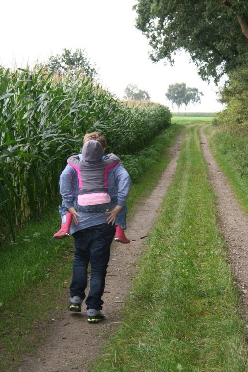 brothers and sisters piggyback hiking