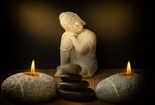 buddha  candles  stones