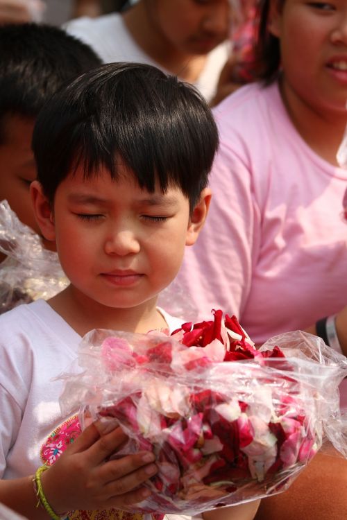 buddhists rose petals children