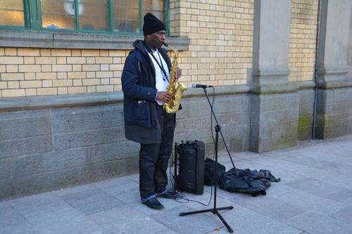 busking begging saxophone