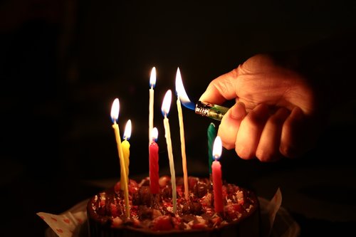 cake  candle  hand