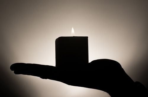 candle meditation hand