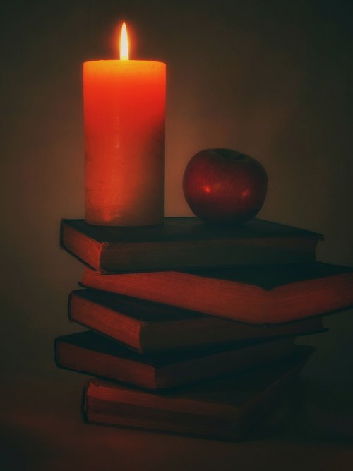 candle  book stack  books