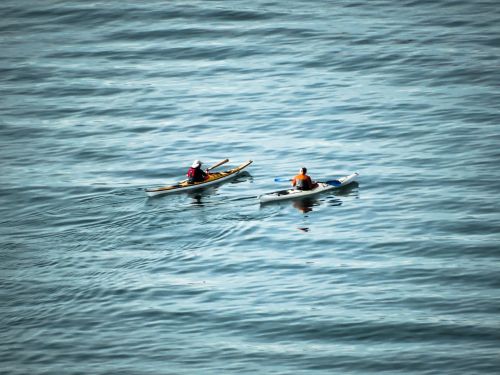 canoe couple sea