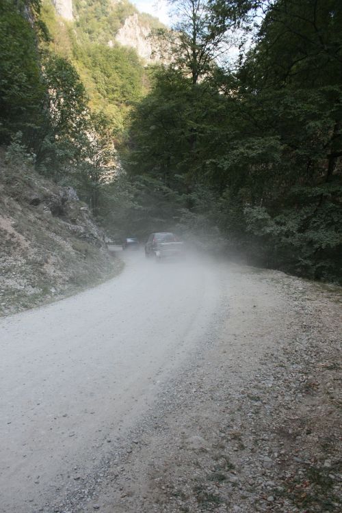 cars dust gravel