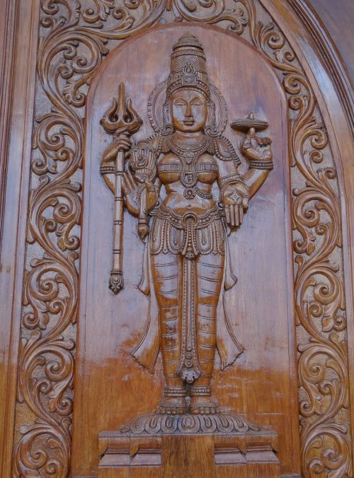 carving wooden goddess