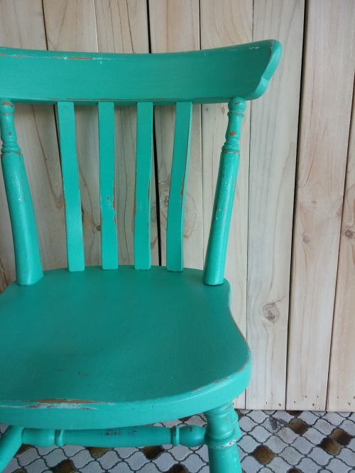 chair turquoise wall