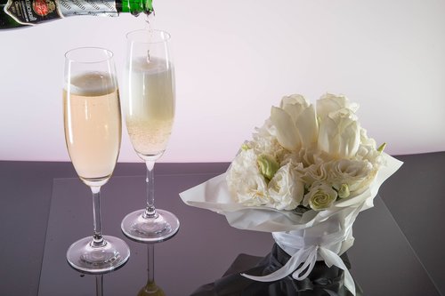 champagne  pours  wine glasses