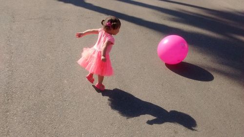 child playing pink