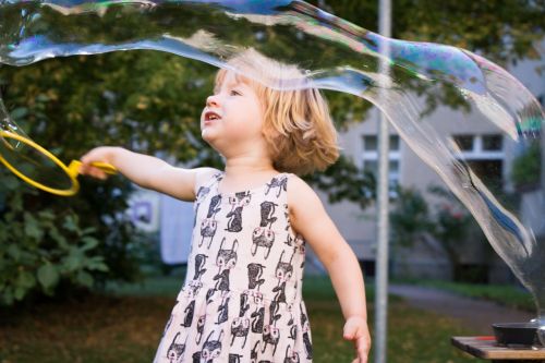 child soap bubbles play outside