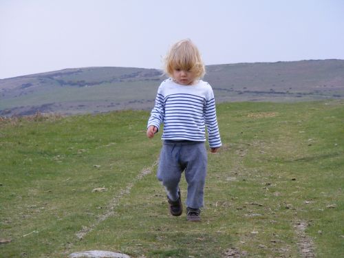 child walking mountains