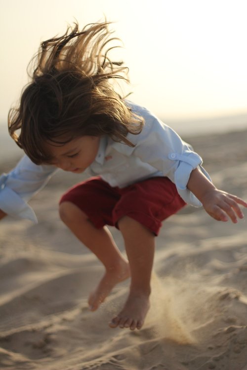 child  desert  jumping