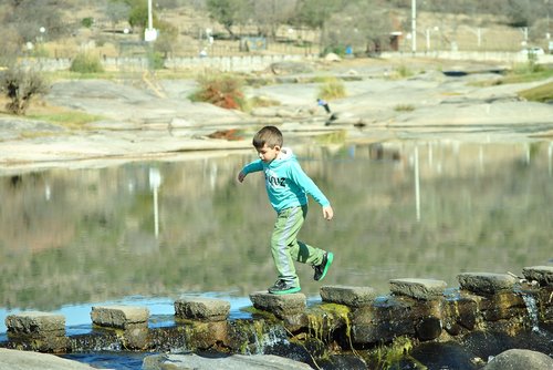 child  river  jump