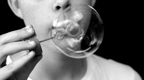 child  blow bubbles  to call