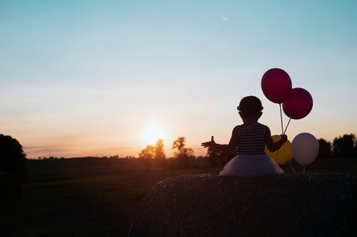 child  sunset  balloons