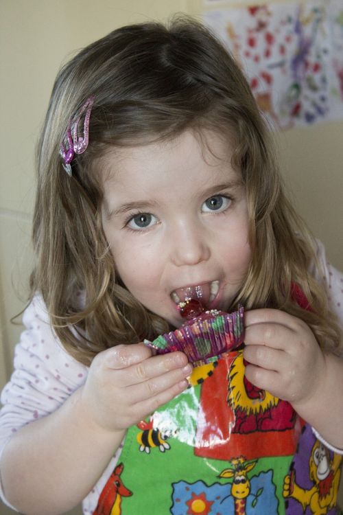 child eating cake