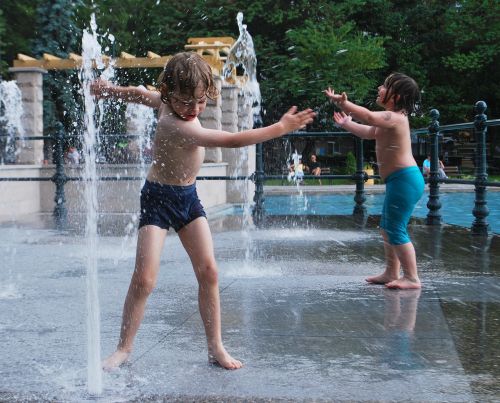 child playing water